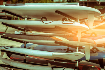 Outdoor mobile stand with surf surfboards and windsurfing for beginners in school