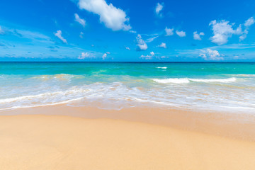 Fototapeta na wymiar Beautiful clear sea beach white sand against blue sky with cloud