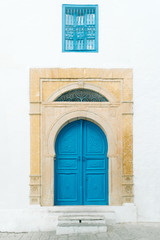 Fototapeta na wymiar Typical local painted door of traditional home Tunisia, Sidi Bou Said
