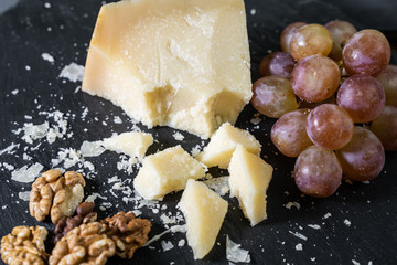 Cheese plate served with grape and nuts