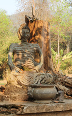 Fototapeta na wymiar Starving Buddha statue in the Buddhist temple.
