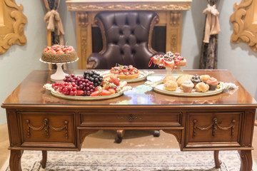 Fruit and bread on antique wooden table