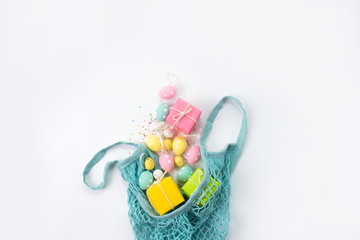bag with sprinkled Easter eggs on a white background. Background for easter