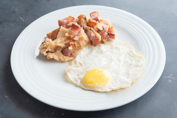 mashed potatoes with slice of bacon and egg