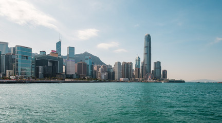 Fototapeta na wymiar Coast and Skyline of Hong kong Island business district and Victoria Harbour