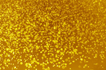 abstract yellow bokeh glitter sparkle background.