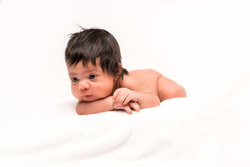 cute and naked mixed race newborn baby isolated on white