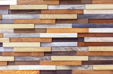 Wooden blocks of different colors. Rectangles from different species of wood.