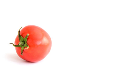 red tomato  on the white ground