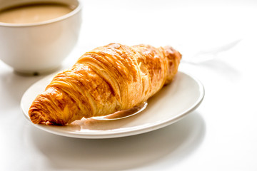 Business lunch with croissant on white table top view