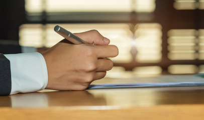 Businessman signing a contract.