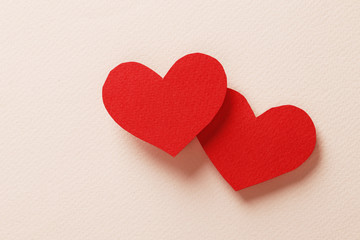 Obraz na płótnie Canvas Decorative hearts close-up on a colored background. Valentine's day decor concept. February 14
