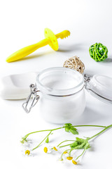 natural organic cosmetics with herbs for baby on white background