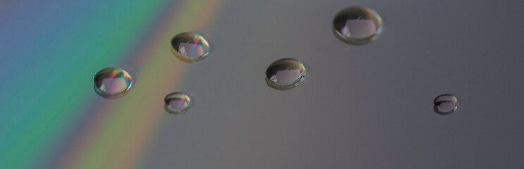 close up of water droplets on CD