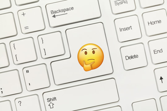 White conceptual keyboard - Key with Thinking Emoji symbol