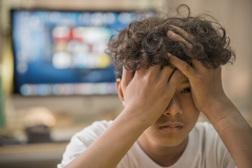 Young asian boy stay alone and sadness
