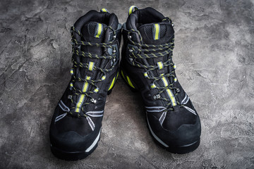 Black hiking boots on the dark table