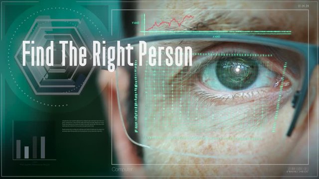 A businessman controlling a futuristic computer screen with a Find the right person Business concept on it.