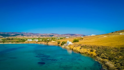 Small greek church on a shore line of Paros island, Greece