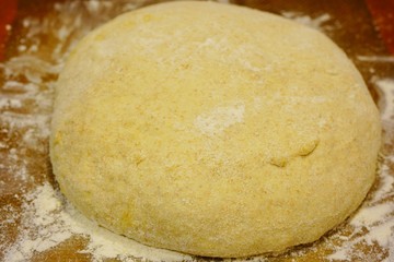 Making a ball with proofed yeast dough for miracle overnight no knead bread