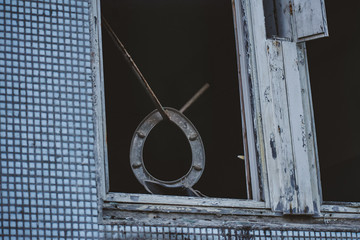 Toilet seat hanging in a window