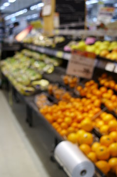 Bokeh image of vegetable section of supermarket