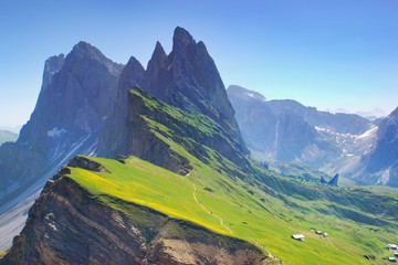 Majestic mountain scenery within spring time - blooming mountain slopes Seceda, Dolomites, Italy, hiking trail