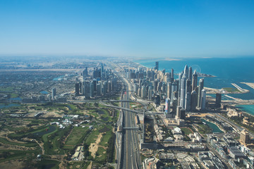 Fototapeta na wymiar Aerial view of Dubai Marina district and sheikh Zayed Road. Dubai, United Arab Emirates.