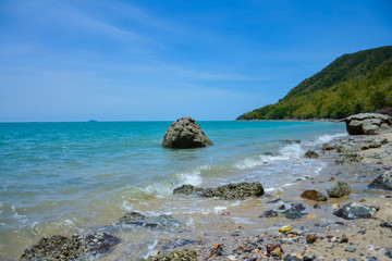 Naklejka premium The beach is full of rocks,beach full of rocks in Montenegro with beautiful view to sea,Beautiful scenery on the beach at low tide seen rocks on the mainland full of charm.