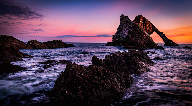 Sunrise at Bow Fiddle Rock - Scotland © greg