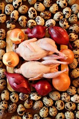 Two quail carcasses on the board and many small eggs