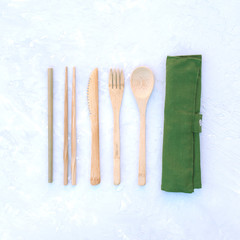 Ecological wooden set of devices for food on a gray background.