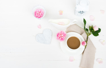 Coffee mug, Milk, Pink Roses Flowers, Rose Petals, Heart on White Wooden table. Happy Valentine's Day, Mother's Day, Women's day, Wedding, Happy Birthday, Love Background or Good Morning concept