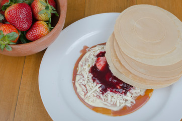 Wafer, traditional Colombian dessert, chopped fruit cookie and sauces