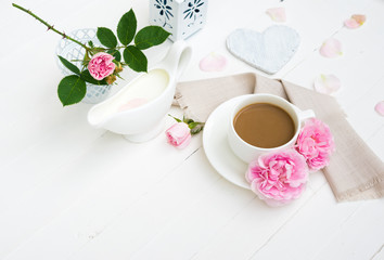 Obraz na płótnie Canvas Coffee mug, Milk, Pink Rose Flowers, Heart, Sketchbook Mock up on White Wooden table. Happy Valentine's Day, Mother's Day, Women's day, Wedding, Happy Birthday, Love Background or Good Morning concept