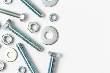 Washers, nuts, bolts, closeup, flat lay, place for text.
