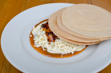 Wafer, traditional Colombian dessert, chopped fruit cookie and sauces