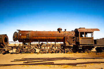 Old rusty steam locomotives near Uyuni in Bolivia. Cemetery trains.