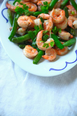Shrimp and snap pea dinner vertical