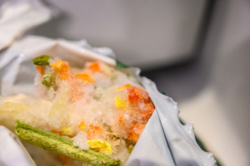 Freezer burned vegetables in plastic wrapping 