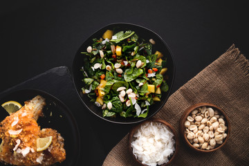 Mediterranean Spinach Salad with mango, peanuts, and red peppers