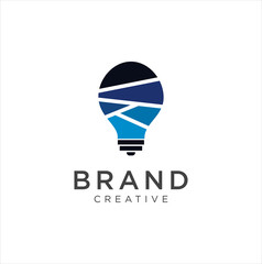Naklejka premium Smart bulb tech logo icon . Idea creative light bulb logo . Bulb digital logo technology Idea .Bulb Logo Design Colorfull . 