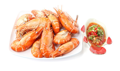 Close up of fresh boiled shrimp in white plate and thai Spicy Seafood Dipping Sauce isolated on white background with clipping path