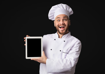 Professional Chef Showing Tablet Computer Blank Screen, Studio Shot