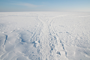 Footprints in the snow, frost, sunny weather.