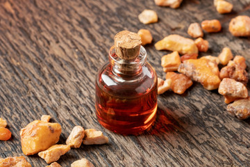 A bottle of styrax benzoin essential oil with benzoin resin
