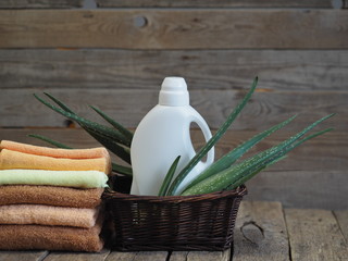 The concept of eco-friendly natural detergents. Detergents and cleaners with aloe vera plant on a...
