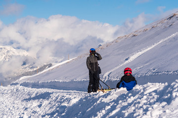 Fototapeta na wymiar sledding on top of a mountain 