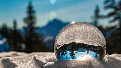 Crystal ball alpine winter wonderland shot at the famous Predigtstuhl, Bad Reichenhall, Bavaria,...