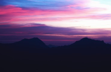 settles mountain peaks and rich colored clouds